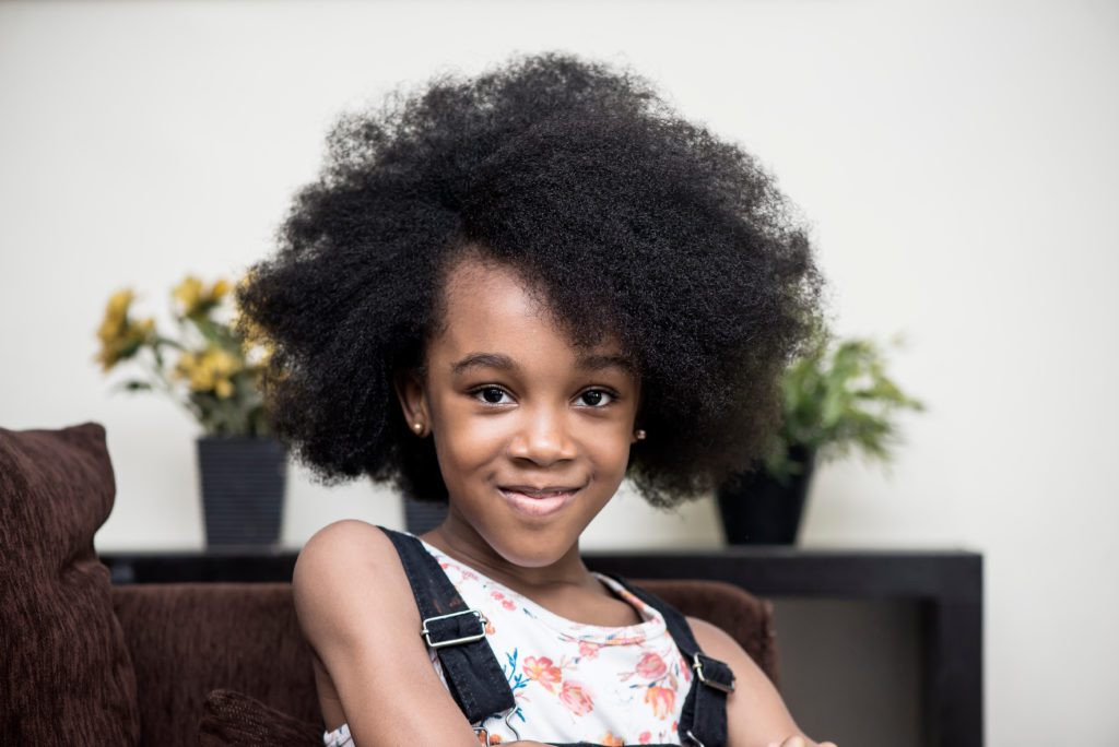 Cute,And,Happy,Nigerian,Girl,With,Natural,Afro young African girl